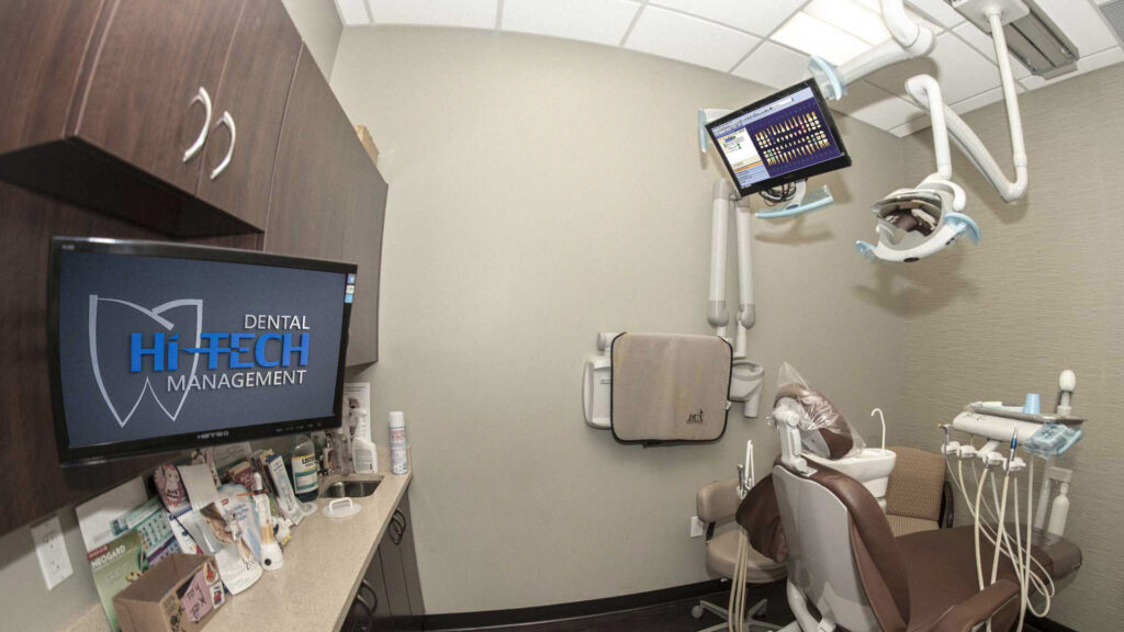 Image of dental management software in action in a dental clinic.